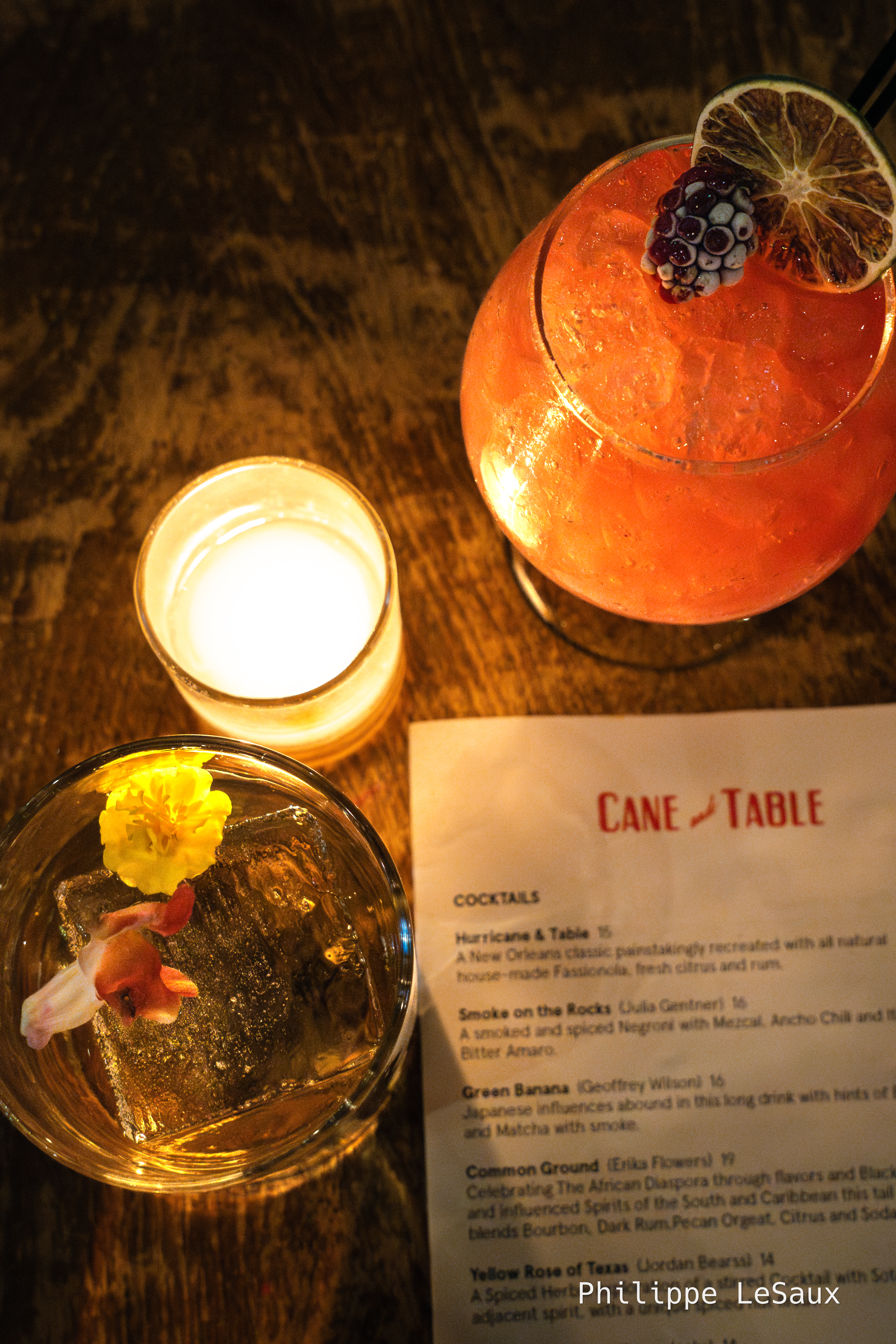 Top view of cocktails and the menu at Cane and Table
