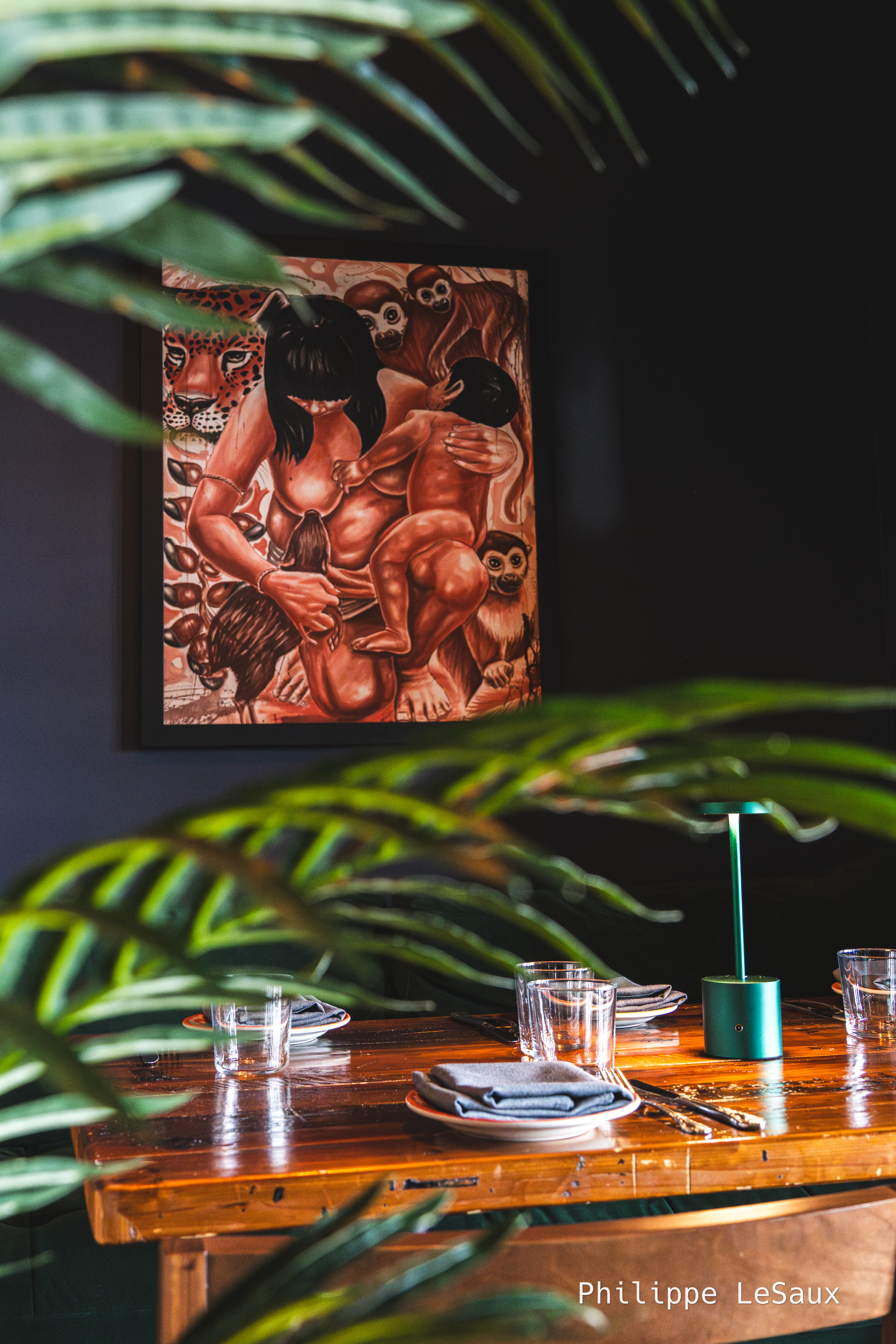 A painting through some greenery