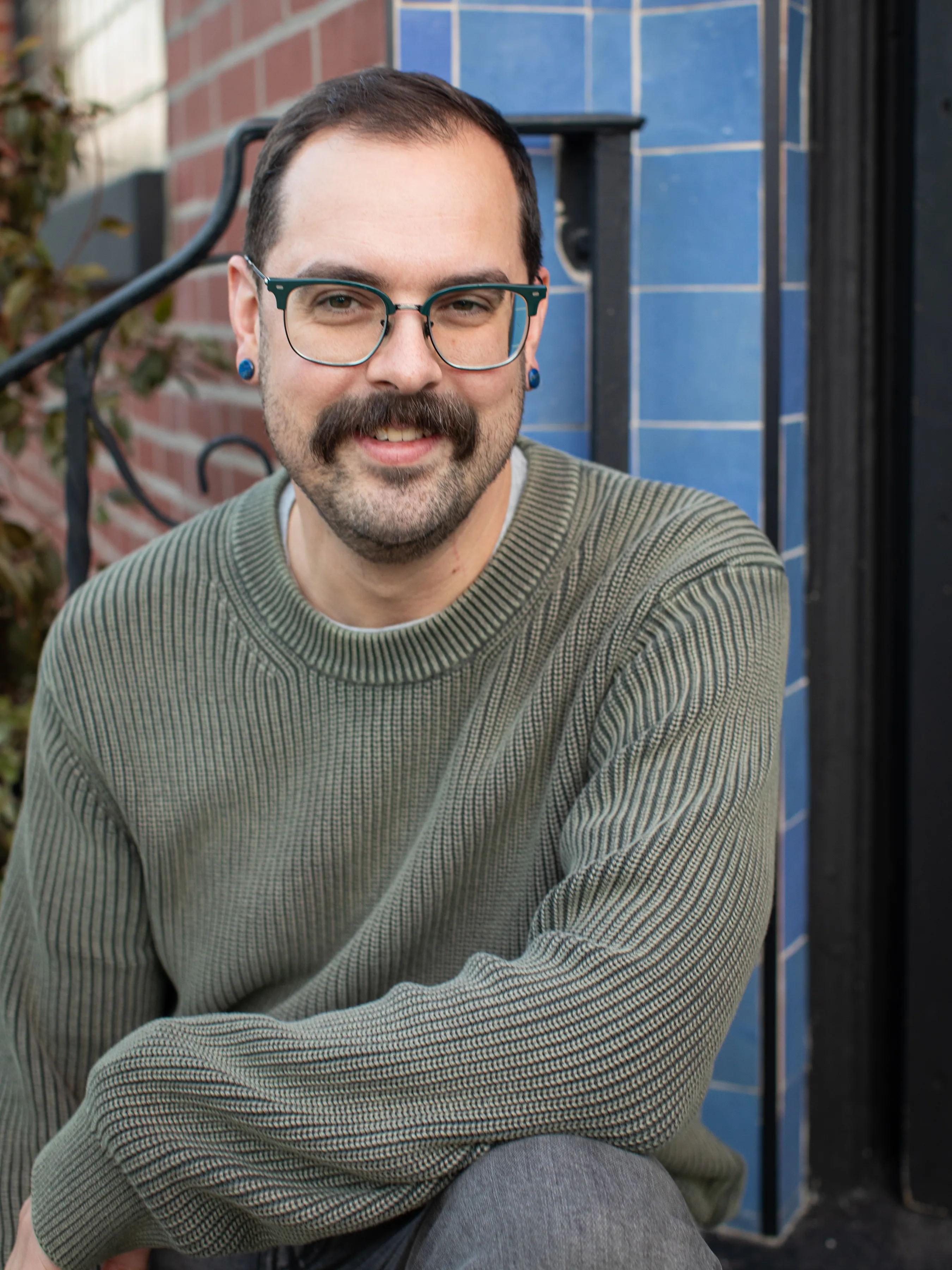 Headshot of Philippe on some steps