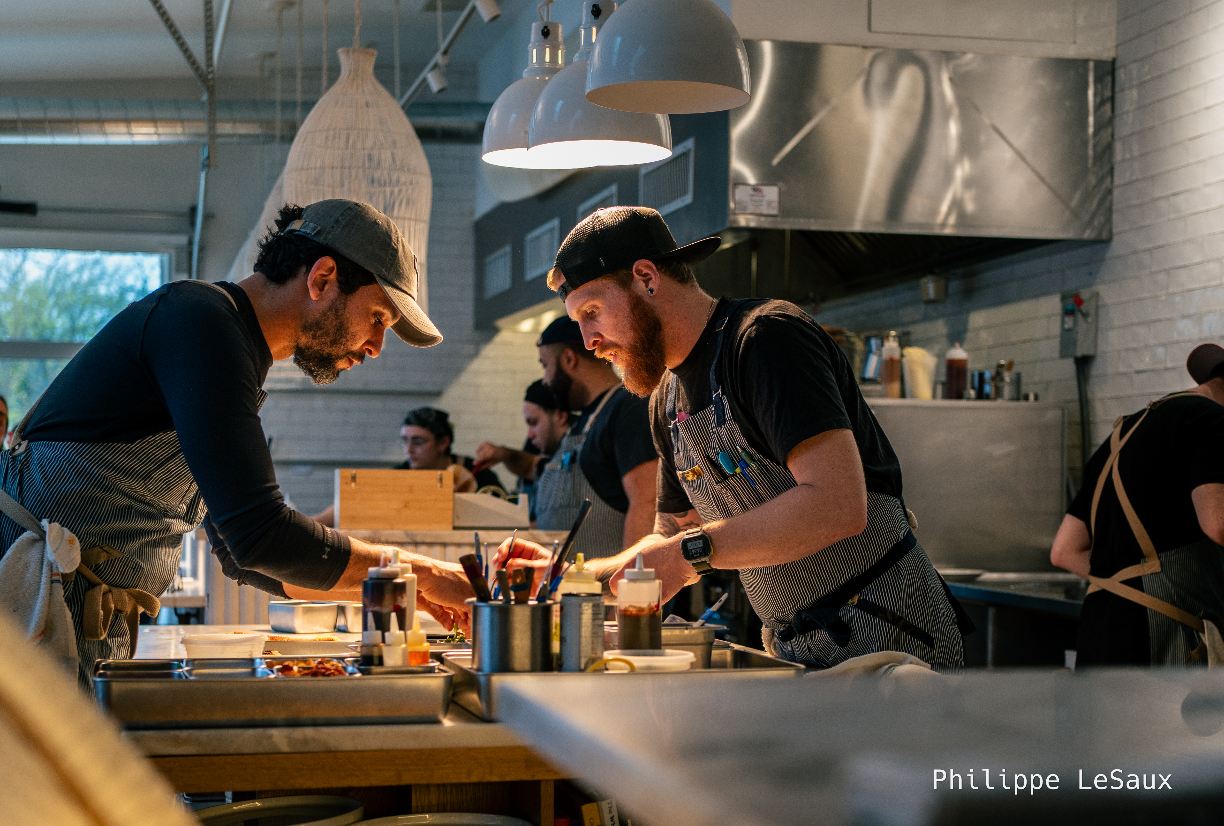 Kitchen staff finish up some dishes