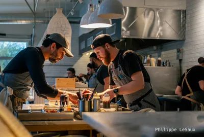 Kitchen staff finish up some dishes