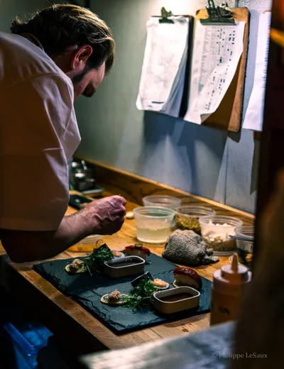 Chef Max Hosey puts the finishing touches on some vegan sushi